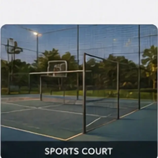 Outdoor sports court with boundary fencing and landscaped surroundings
